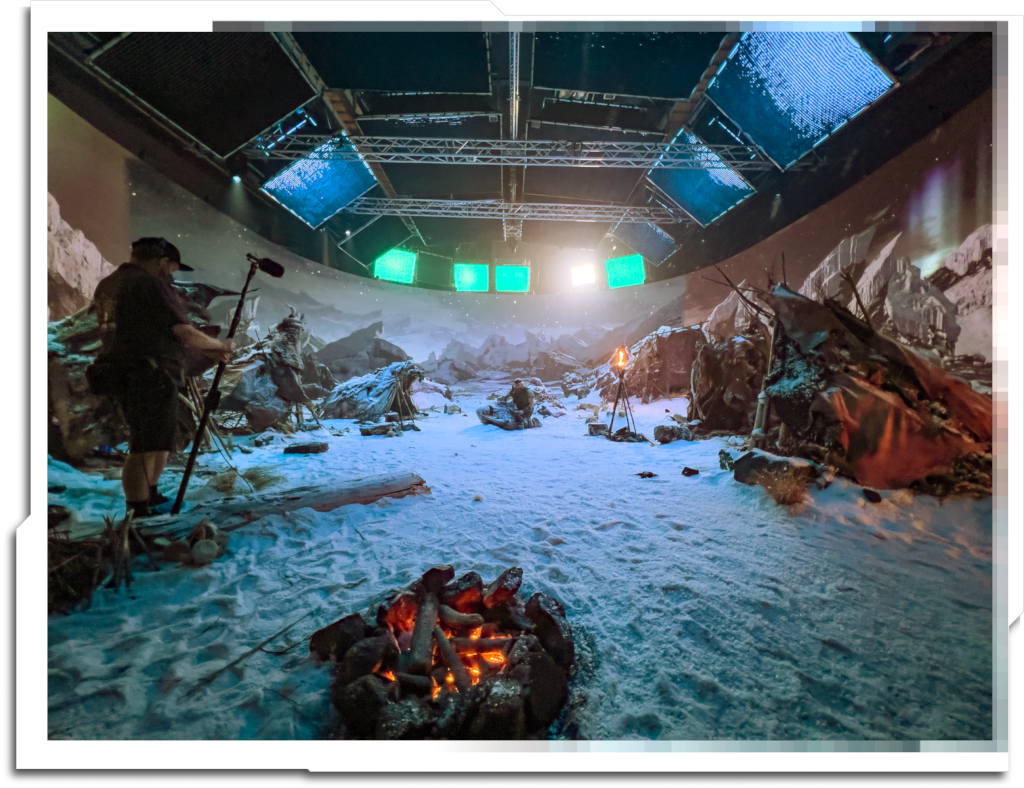 The settlement is seen in three different lighting scenarios, including one at night with a realtime Aurora Borealis I created that seems to have made it to the final shot almost untouched!